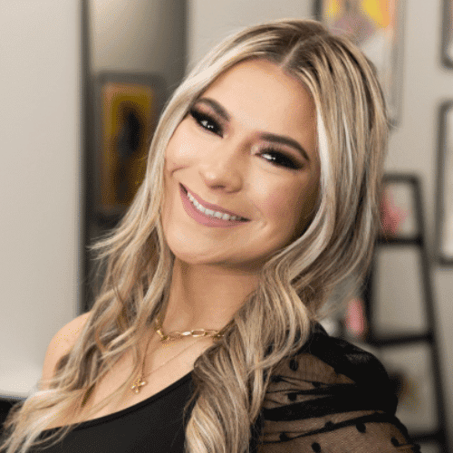 Portrait of Kayla, a professional stylist at The Cut Salon, showcasing their expertise and style.