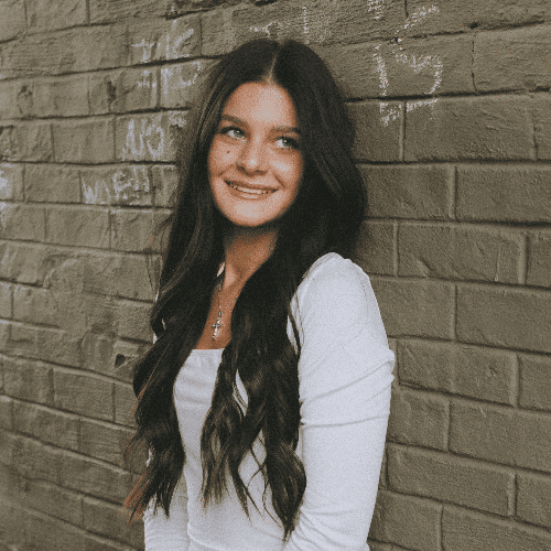 Portrait of Nicolette, a professional stylist at The Cut Salon, showcasing their expertise and style.