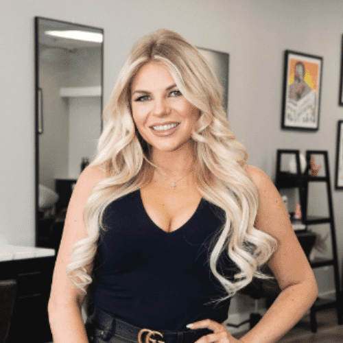Portrait of Shannon, a professional stylist at The Cut Salon, showcasing their expertise and style.